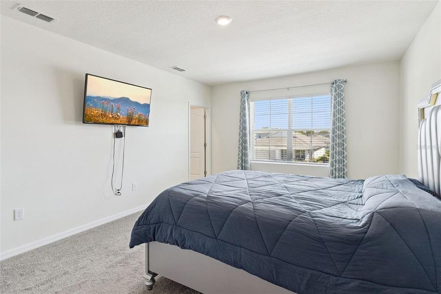 Furnished interior view inside a new home in Harmony at Lake Eloise, Winter Haven (Image 31).