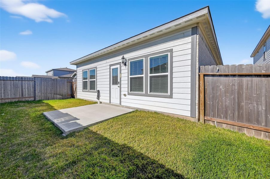 Exterior details and patio area of a home in , Magnolia (Image 4). Exterior details and patio area of a home in , Magnolia (Image 4).
