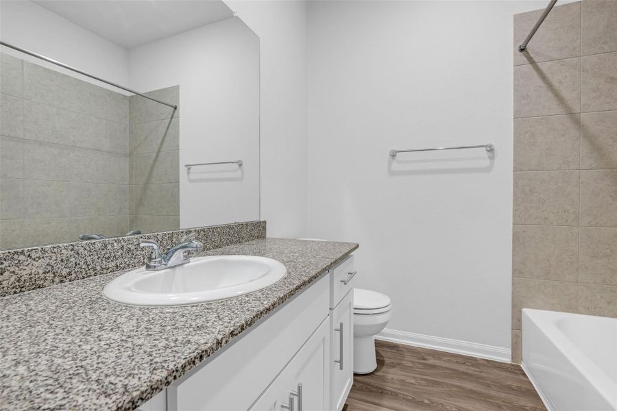 2nd bath conveniently located in the middle of the house layout for easy guest access.