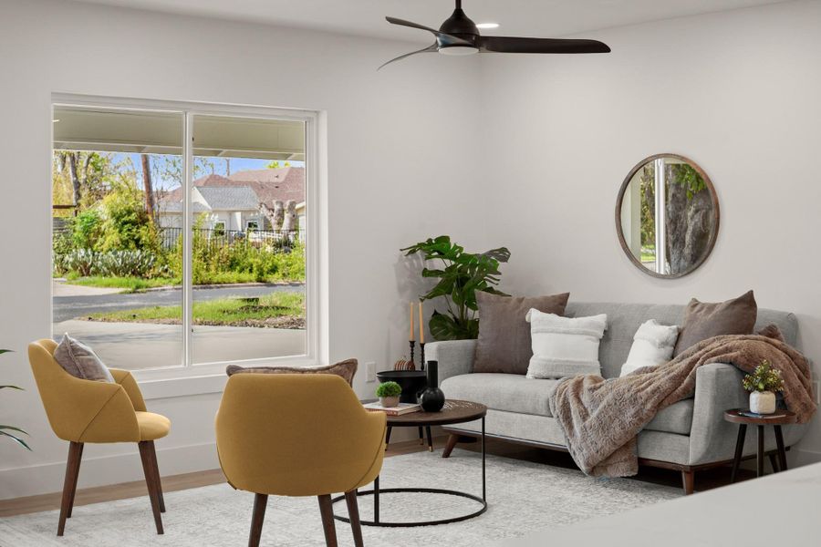 Living room with ceiling fan and wood finished floors