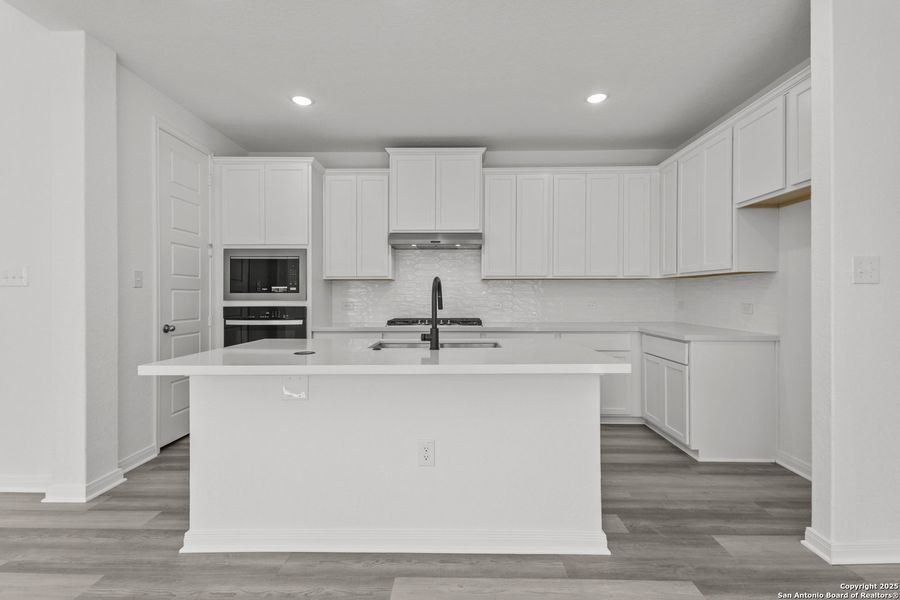 Furnished interior view inside a new home in Ladera 50', San Antonio (Image 11).