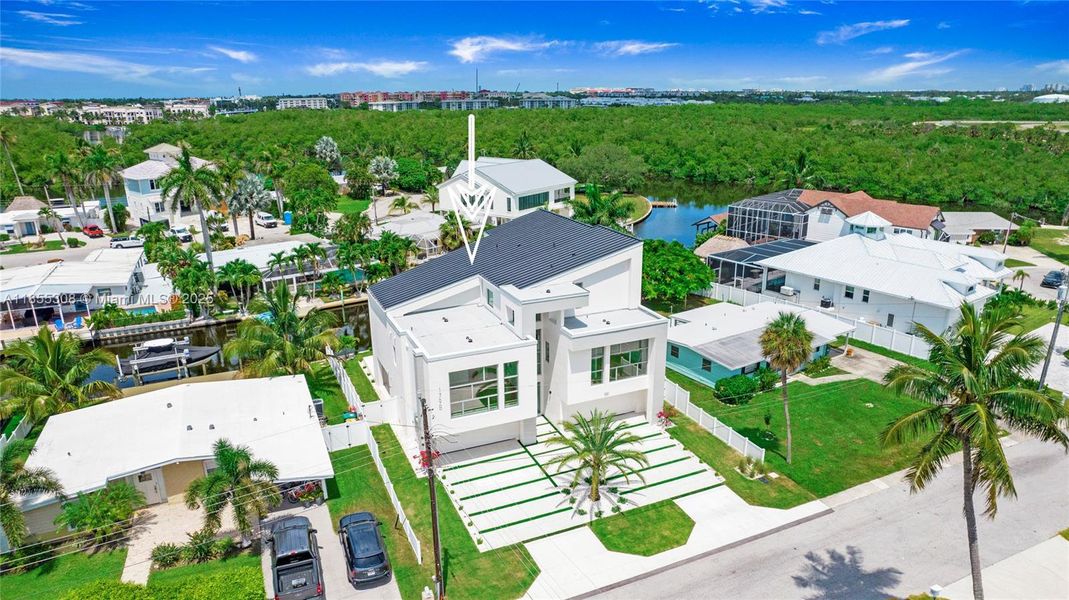 Front exterior of a new home in , Naples, FL, highlighting curb appeal (Image 24).