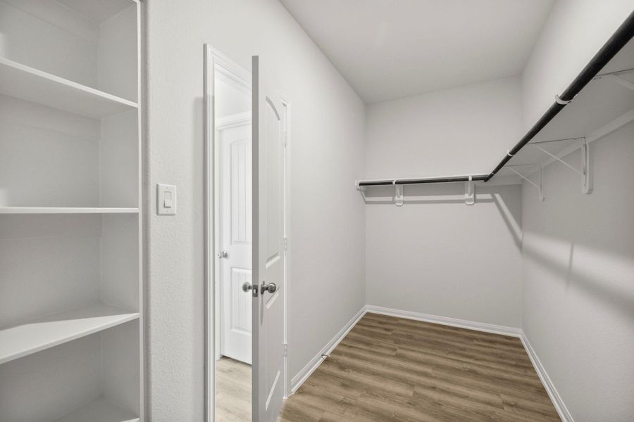 Opposite view of expansive primary closet
