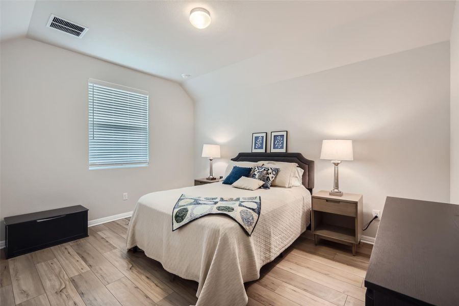 The 3rd bedroom is large and full of natural light!  Your family or guests will never want to leave this room!