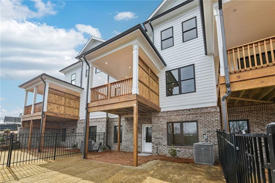 Exterior details and patio area of a home in Millcroft Townhomes, Buford (Image 23). Exterior details and patio area of a home in Millcroft Townhomes, Buford (Image 23).