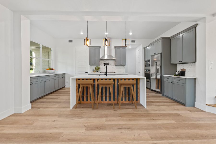 Discover effortless living in this modern, open-concept home with a kitchen that seamlessly connects to the central living area. Discover effortless living in this modern, open-concept home with a kitchen that seamlessly connects to the central living area.