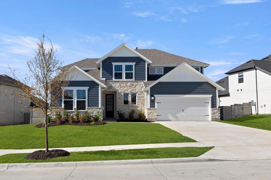 Front exterior of a new home in Inspiration Collection 60 at Painted Tree, McKinney, TX, highlighting curb appeal (Image 1).