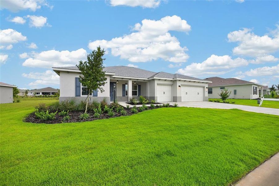 Front exterior of a new home in , Ocala, FL, highlighting curb appeal (Image 27).