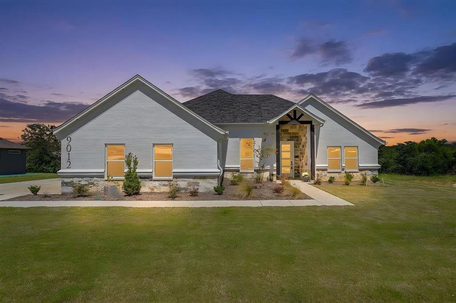 Front exterior of a new home in , Springtown, TX, highlighting curb appeal (Image 26). Front exterior of a new home in , Springtown, TX, highlighting curb appeal (Image 26).