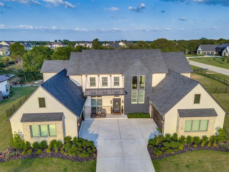 Front exterior of a new home in , Oak Point, TX, highlighting curb appeal (Image 20).