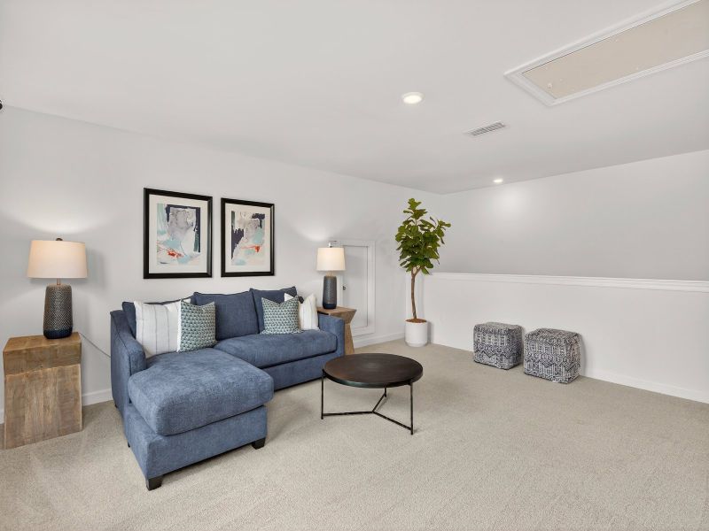 The upstairs loft conveniently leads to each secondary bedroom.