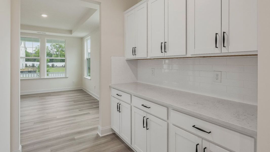 Stonehaven home plan butler's pantry connecting formal dining room and kitchen