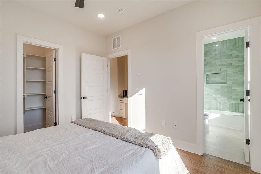 Comfortable secondary bedroom with designer flooring and stylish trim details. Comfortable secondary bedroom with designer flooring and stylish trim details.