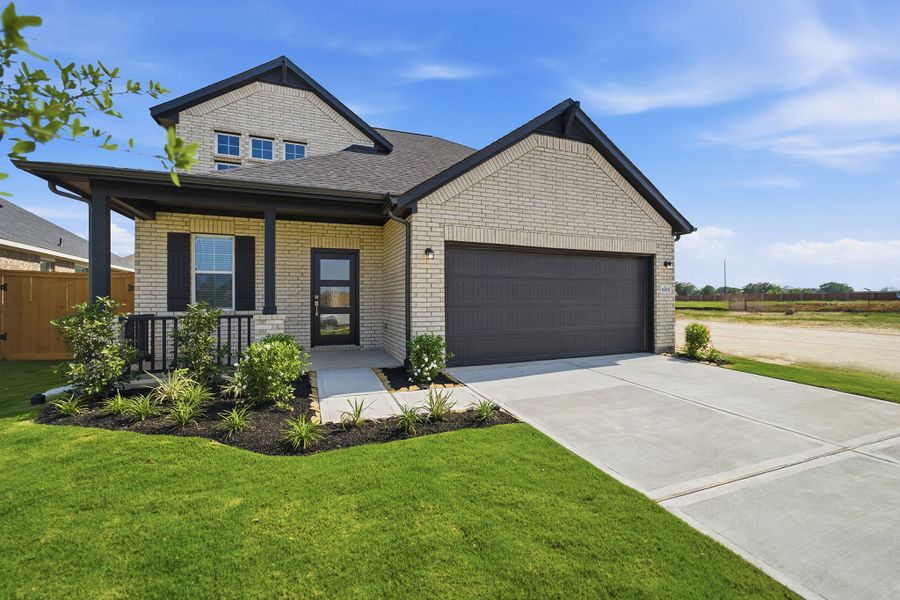 Front exterior of a new home in Wildrye, Waller, TX, highlighting curb appeal (Image 2). Front exterior of a new home in Wildrye, Waller, TX, highlighting curb appeal (Image 2).