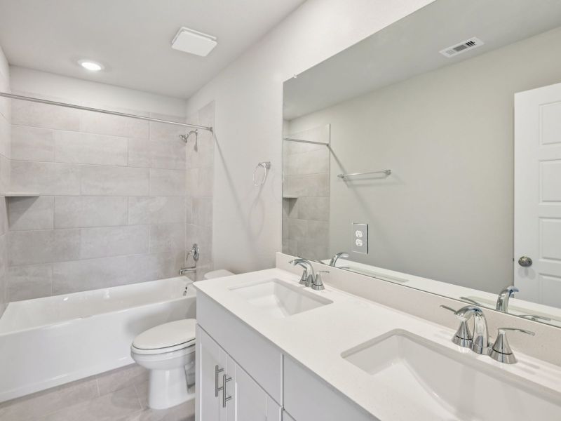 Furnished interior view inside a new home in Granger Pointe - Traditional Series, Conroe (Image 12).