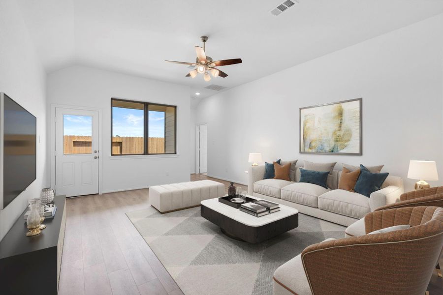 Your family room has ample space to entertain family and friends. This space features beautiful floors, fresh paint, ceiling fan with lighting, and high ceilings. Your family room has ample space to entertain family and friends. This space features beautiful floors, fresh paint, ceiling fan with lighting, and high ceilings.