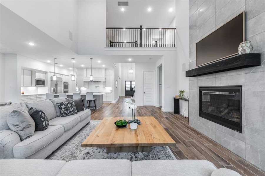 This photo perfectly captures the expansive open floor plan.  Yet it is also inviting and cozy.  The floor plan of this home is modern and meets todays current household needs.