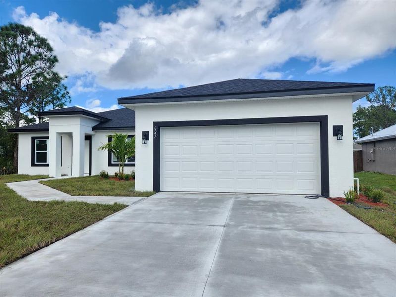 Front exterior of a new home in , Palm Bay, FL, highlighting curb appeal (Image 27). Front exterior of a new home in , Palm Bay, FL, highlighting curb appeal (Image 27).