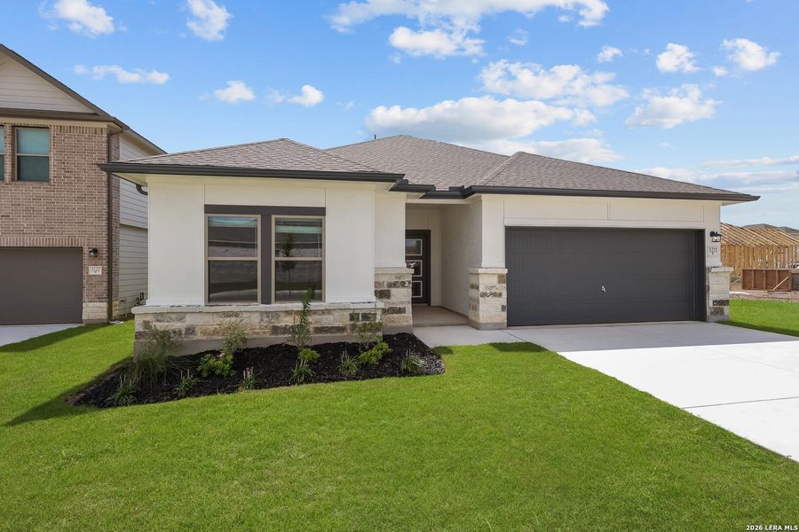 Front exterior of a new home in Summerlin, San Antonio, TX, highlighting curb appeal (Image 24).