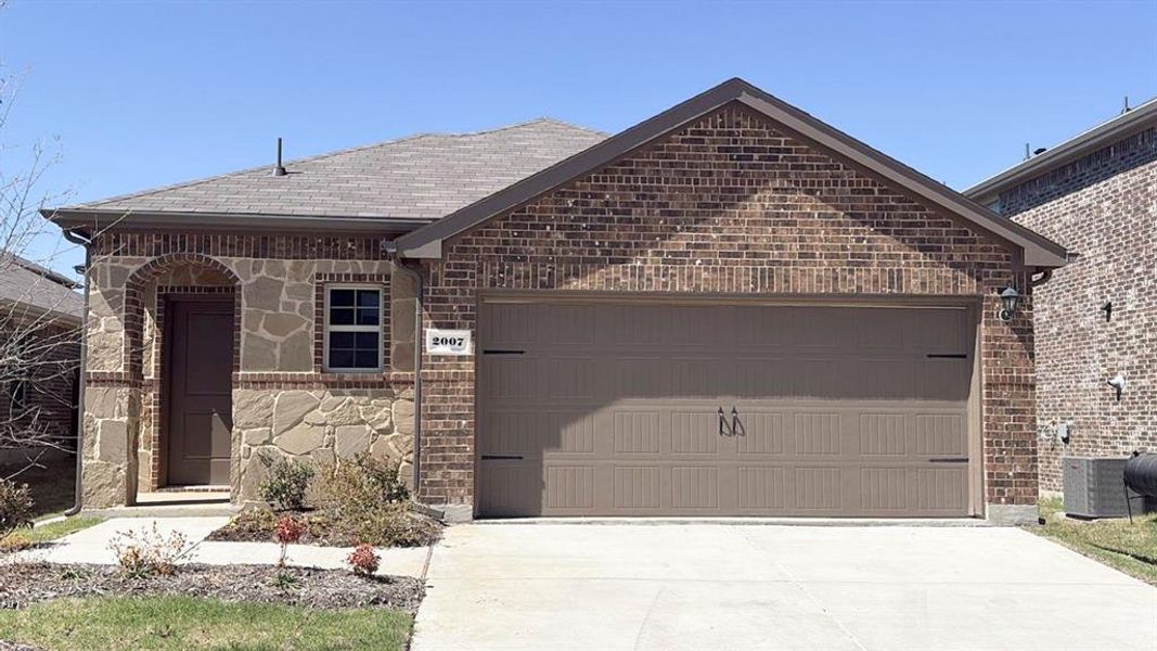 Front exterior of a new home in Wildcat Ranch, Crandall, TX, highlighting curb appeal (Image 1). Front exterior of a new home in Wildcat Ranch, Crandall, TX, highlighting curb appeal (Image 1).