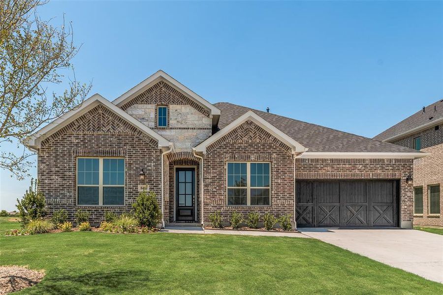 Front exterior of a new home in Villages of Creekwood, Frisco, TX, highlighting curb appeal (Image 16). Front exterior of a new home in Villages of Creekwood, Frisco, TX, highlighting curb appeal (Image 16).