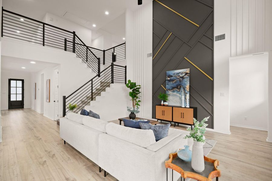 A wide entry foyer flows past the home office and formal dining room into the gorgeous sunlit open floor plan living area. A wide entry foyer flows past the home office and formal dining room into the gorgeous sunlit open floor plan living area.