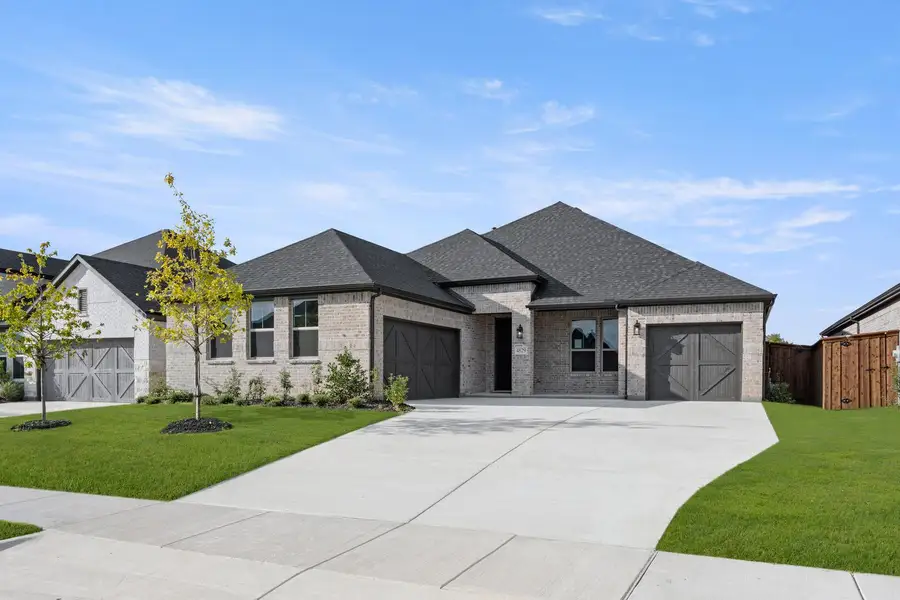 Representative exterior photo of a completed home built from the Brett by Tri Pointe Homes in LaPrelle, Haslet, TX (Image 1). Representative exterior photo of a completed home built from the Brett by Tri Pointe Homes in LaPrelle, Haslet, TX (Image 1).