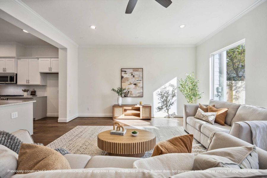A closer look at the living room highlights the thoughtful design—plenty of room for a media setup or statement artwork, plus natural light that changes with the day.