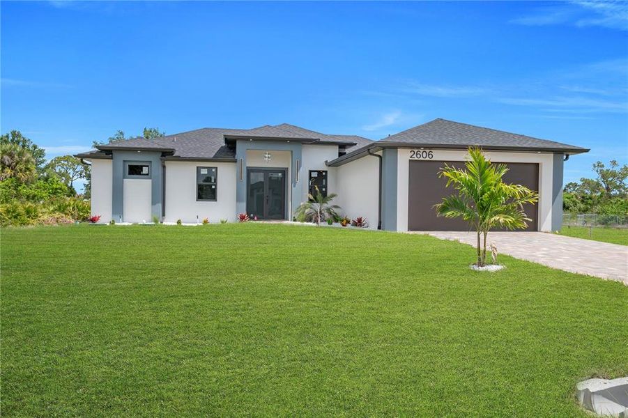 Front exterior of a new home in , Lehigh Acres, FL, highlighting curb appeal (Image 2). Front exterior of a new home in , Lehigh Acres, FL, highlighting curb appeal (Image 2).