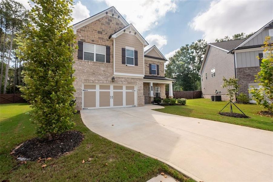 Front exterior of a new home in , Lawrenceville, GA, highlighting curb appeal (Image 24).