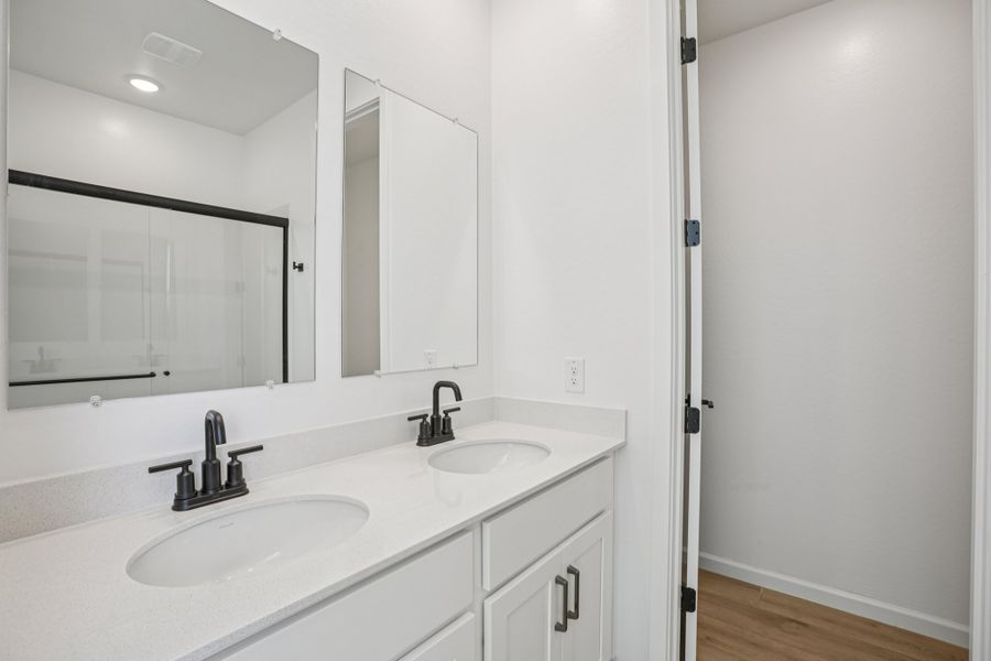 Primary bath. Finishes and options may vary by community.
