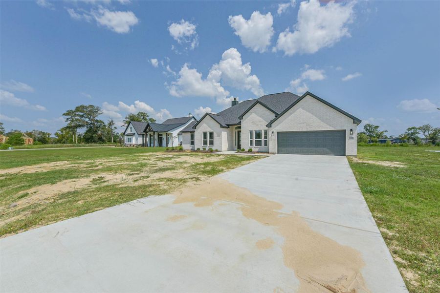 Front exterior of a new home in , Baytown, TX, highlighting curb appeal (Image 26).