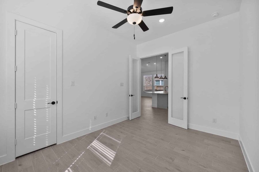 Representative unfurnished interior of a home built from the Summerton by Chesmar Homes in Grange, Katy (Image 15).