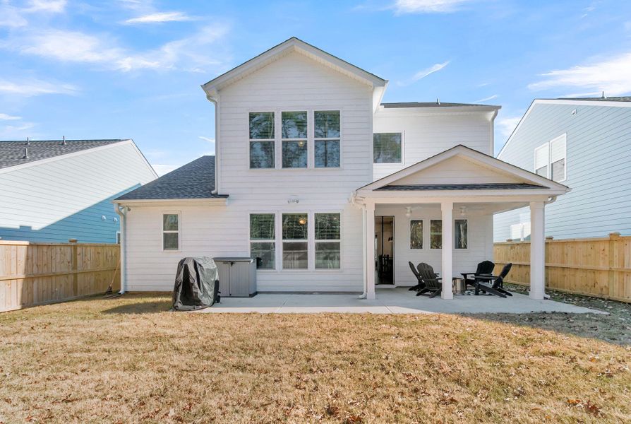 Exterior details and patio area of a home in , Ravenel (Image 27).