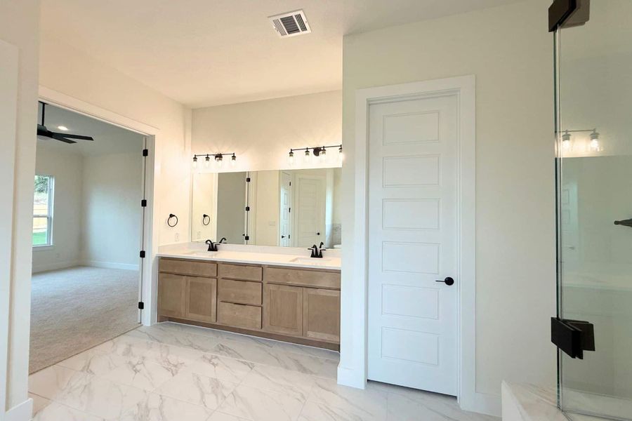 Furnished interior view inside a new home in Heights at San Gabriel, Georgetown (Image 9).