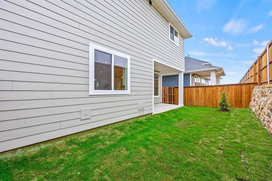 Exterior details and patio area of a home in North Square at Uptown, Celina (Image 3).