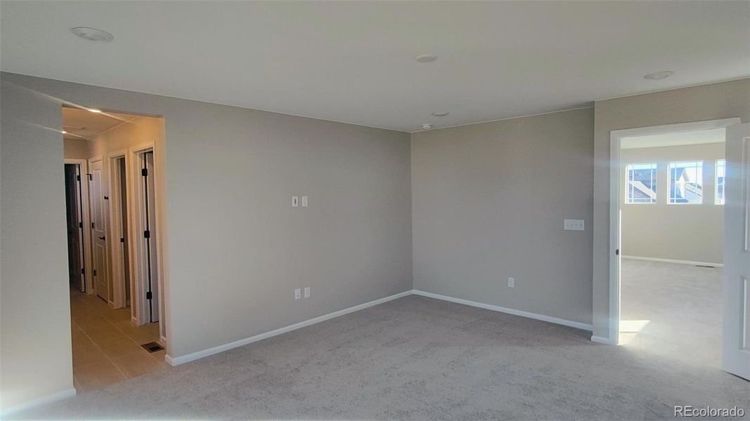 Spacious, unfurnished interior of a new home in The Cottages Collection at Ridgeline Vista, Brighton (Image 6).