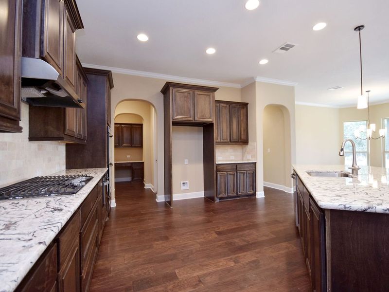 Representative furnished interior of a home built from the Madera II by Giddens Homes in Scofield Farms Estates, Georgetown (Image 243).