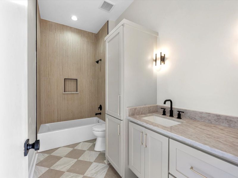 Covered patio with outdoor kitchen, prewire for cameras and tv, ceiling fan, and full outdoor bathroom. The stunner is the sliding doors!