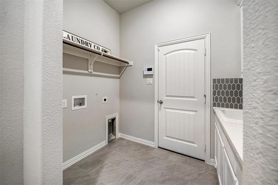 Laundry room with electric dryer hookup and hookup for a washing machine Laundry room with electric dryer hookup and hookup for a washing machine