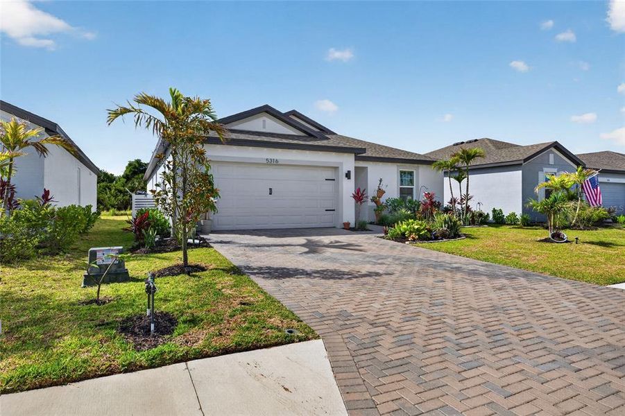 Front exterior of a new home in , Palmetto, FL, highlighting curb appeal (Image 24). Front exterior of a new home in , Palmetto, FL, highlighting curb appeal (Image 24).