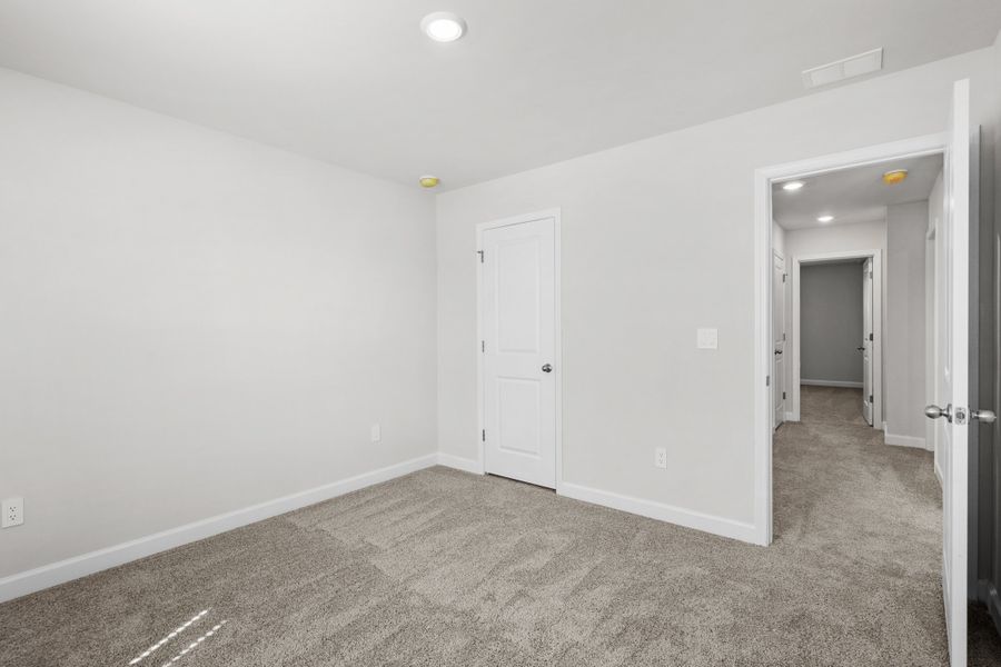 Spacious, unfurnished interior of a new home in Waterside - Coastline Series, Longs (Image 28).