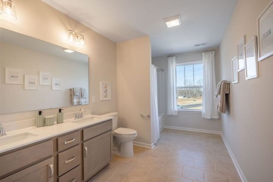 Representative furnished interior of a home built from the Lenox by True Homes in Whispering Hills, Locust (Image 15).