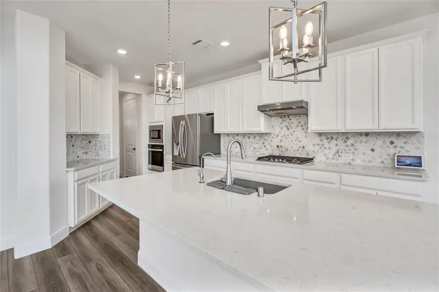 Furnished interior view inside a new home in Harper's Preserve - Classic Series, Conroe (Image 9). Furnished interior view inside a new home in Harper's Preserve - Classic Series, Conroe (Image 9).