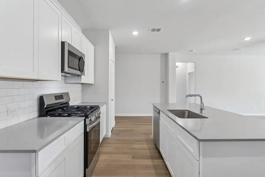 Kitchen in the Harrison home plan by Trophy Signature Homes – REPRESENTATIVE PHOTO Kitchen in the Harrison home plan by Trophy Signature Homes – REPRESENTATIVE PHOTO
