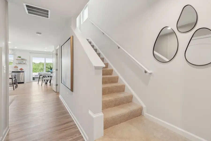 Representative furnished interior of a home built from the The Rutledge by Stanley Martin Homes in Essence at Trinity Townhomes, Columbia (Image 17).