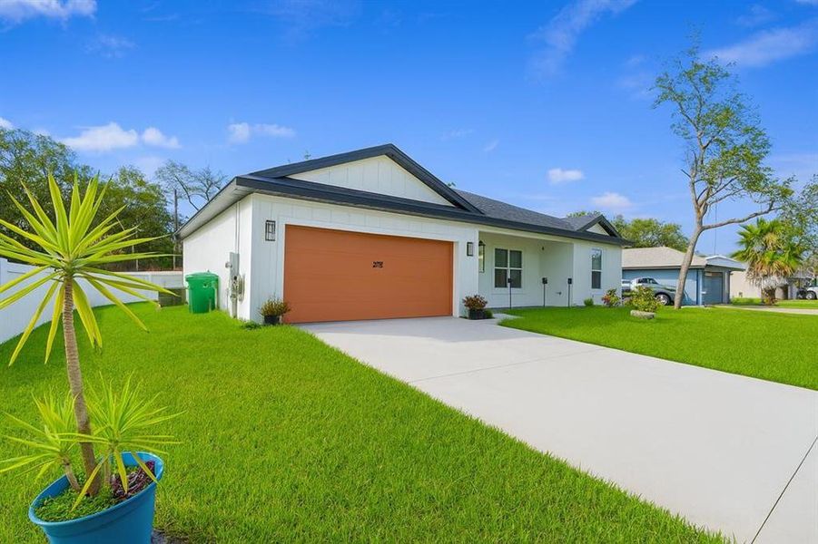 Front exterior of a new home in , Deltona, FL, highlighting curb appeal (Image 1).