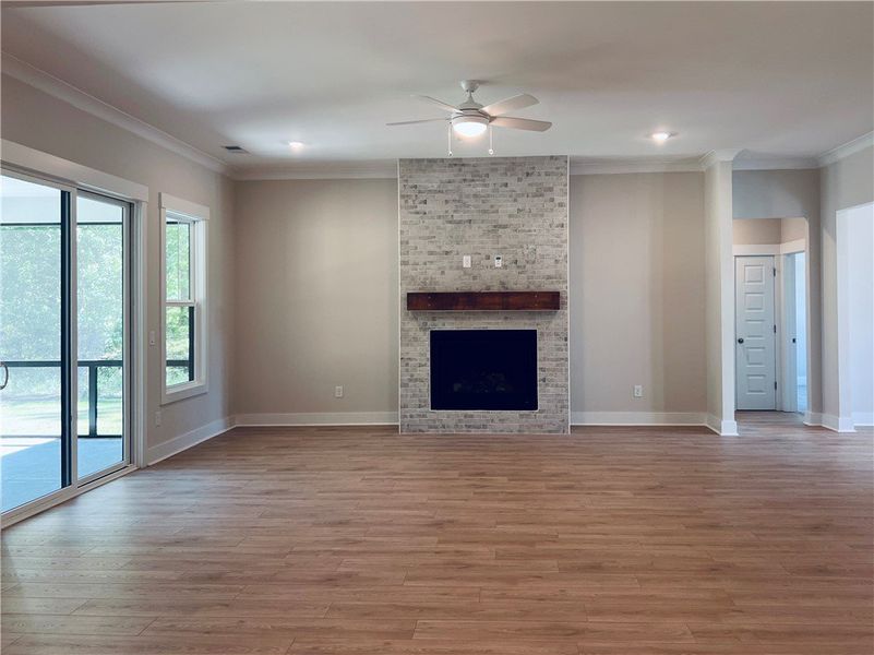 This expansive living area features a stylish fire