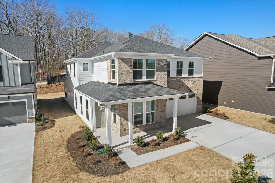 Front exterior of a new home in Elmbrook, Indian Trail, NC, highlighting curb appeal (Image 21).