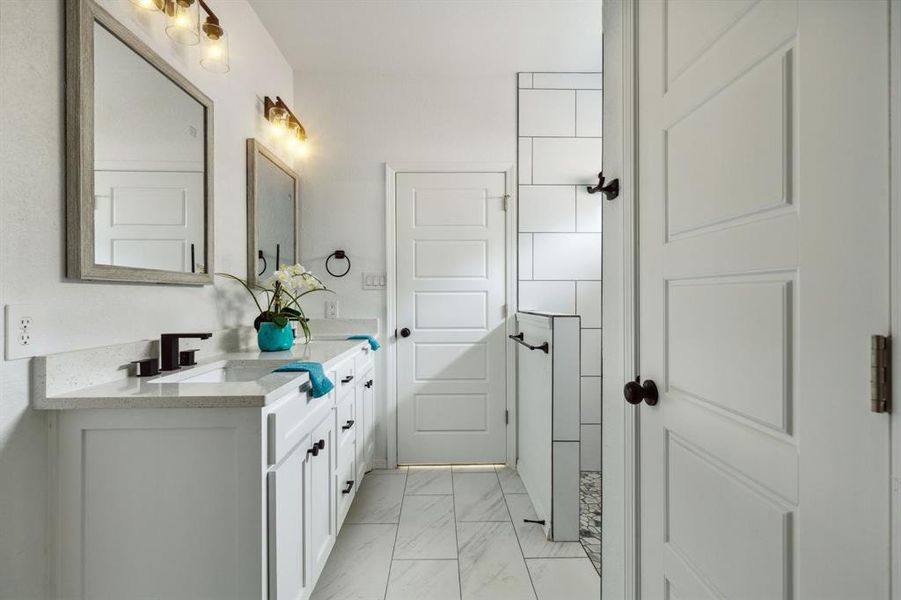 Bathroom with vanity and tile patterned floors